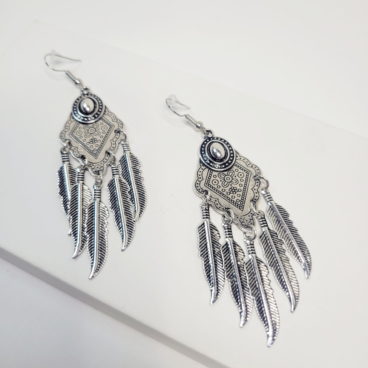 Bohemian Feather Drop Earrings. Silver tone.