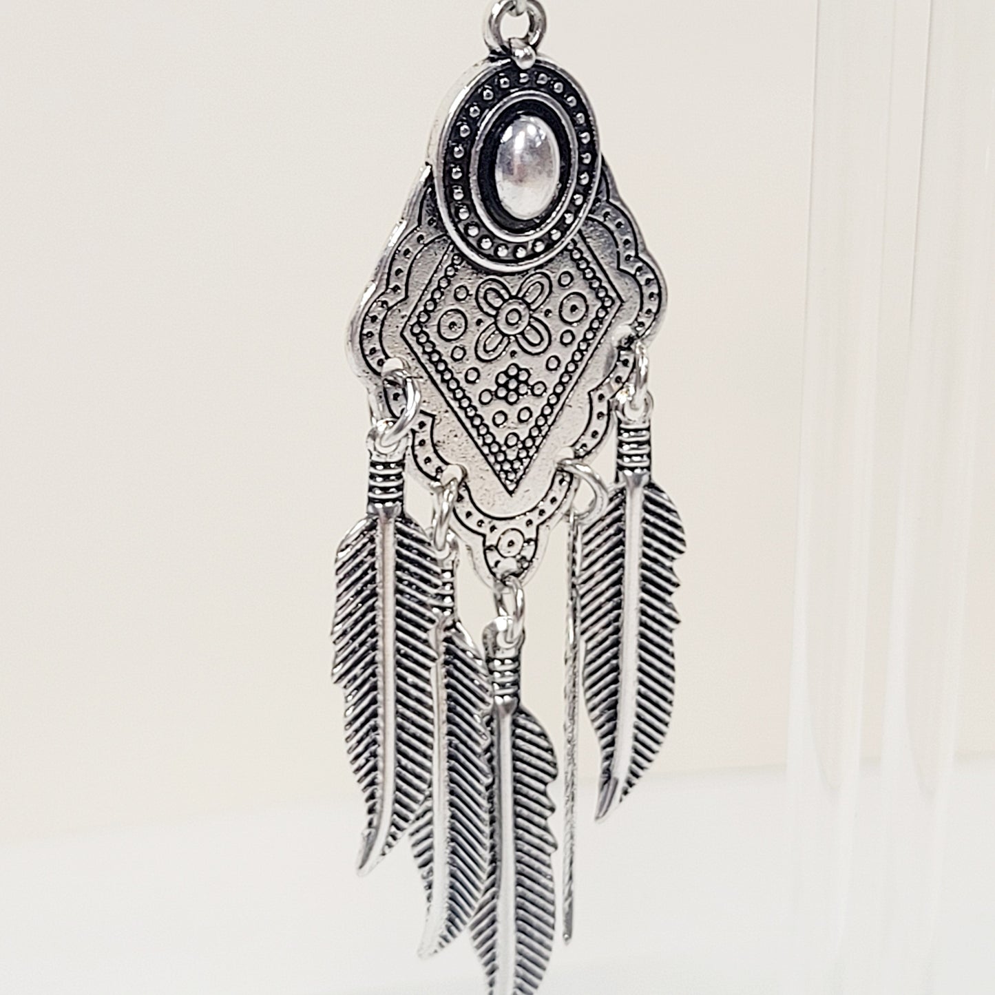Bohemian Feather Drop Earrings. Silver tone.