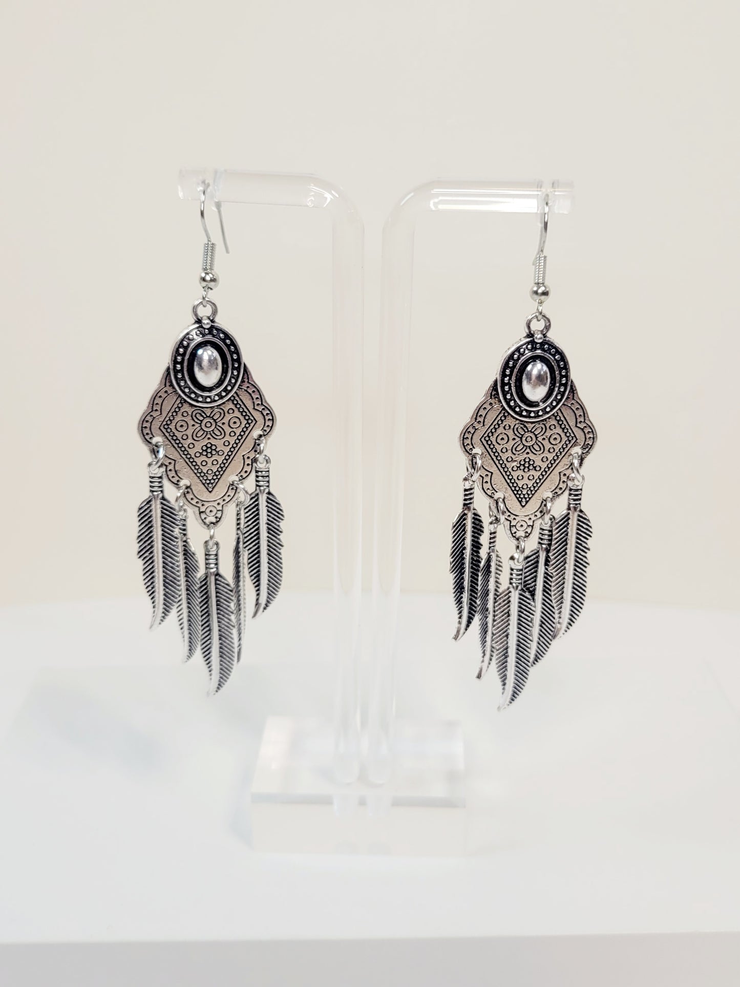 Bohemian Feather Drop Earrings. Silver tone.
