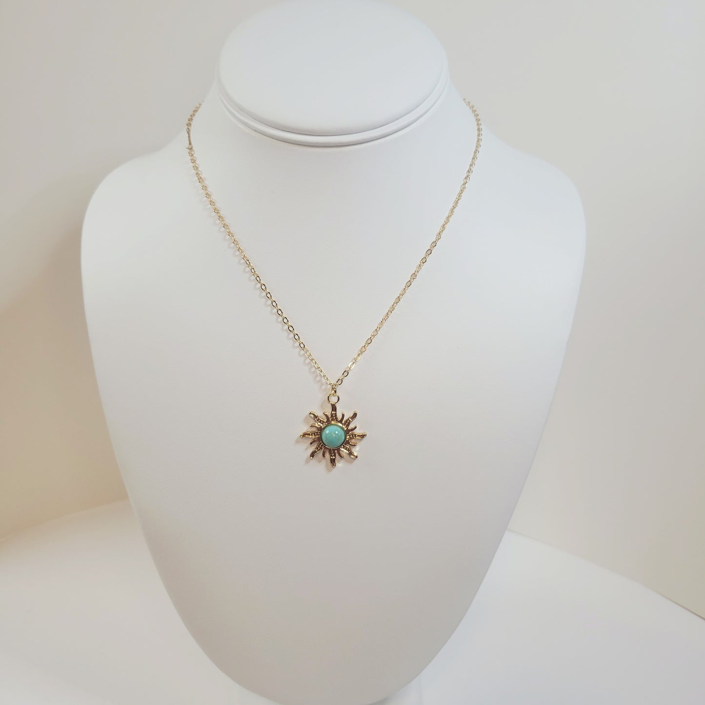 Turquoise Sun Pendant. Gold-toned.